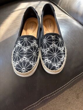 Clarks Black Slip-On Flats with White Floral Embroidery